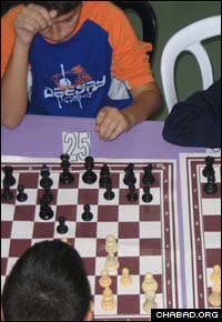 Israeli schoolchildren take part in a chess competition organized by champion Dov Zaltz, a Chabad-Lubavitch Chasid.