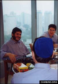 Chabad-Lubavitch rabbinical student Mendy Kotlarsky gives a Torah class to Jewish businessmen in Singapore.