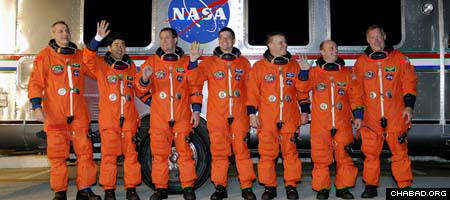 The crew of the space shuttle Endeavor, which lifted off early Tuesday morning. Garret Reisman, second from right, became the first Jewish resident of the International Space Station on Thursday.