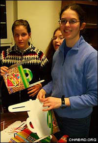 Students from the University of Illinois at Urbana-Champaign make Purim gift baskets known as mishloach manot.