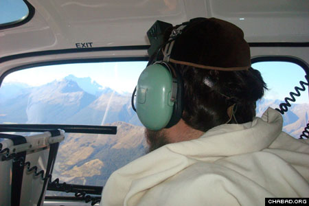 Rabbi Mendel Goldstein, co-director of Chabad-Lubavitch of New Zealand, surveys the area around Queenstown, New Zealand, for signs of missing Israeli backpacker Liat Tess-Okin in the days before Passover.