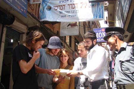 In Nepal, Israeli tourists confer with a Chabad-Lubavitch rabbinical student, one of hundreds who traveled across the globe to lead Passover Seders in cities not served by full-time rabbis or emissaries.