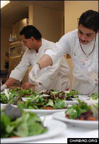 Assistants of chef Linda Bergh put the final touches on salads for the 10th anniversary dinner of the Chabad Jewish Center in S. Fe, N.M.