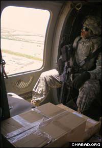 Passover provisions from the Aleph Institute fly to Baghdad aboard a military helicopter.