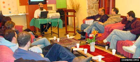 Visitors to Ascent, a Chabad-Lubavitch center in Safed, Israel, listen to a presentation on Jewish mysticism.