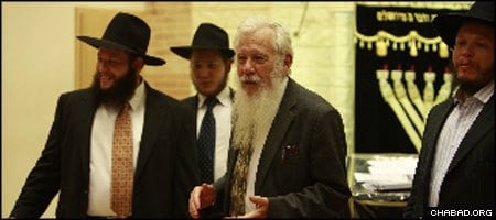 Professor Israel (Robert) J. Aumann, second from right, addresses the Chabad-Lubavitch yeshiva in Warsaw, Poland.