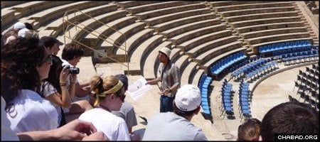 Participants of a Mayanot-provided Taglit-birthright israel trip visit the remains of the Roman amphitheater in Caesarea, Israel.