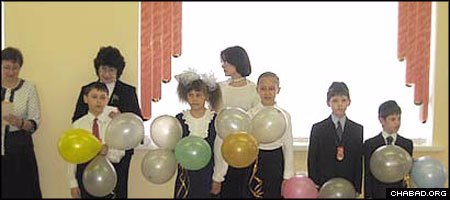 Children from the Ohr Avner Chabad Day School in Omsk, Russia, celebrate the final day of the school year.