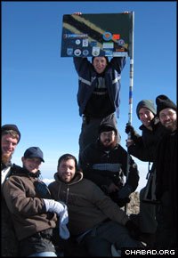 Participants of a Tanzania trek sponsored by Chabad-Lubavitch of Hendon in London celebrate upon reaching the top of the nearly 15,000-foot tall Mount Meru volcano.
