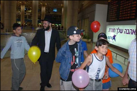 The arrival of Children of Chernobyl’s 81st group in Israel was marked by dancing through Ben Gurion International Airport. The program, directed by Chabad-Lubavitch Rabbi Yossie Raichik, provides children with living quarters in a dormitory in the village of Kfar Chabad, as well as medical treatment and schooling.
