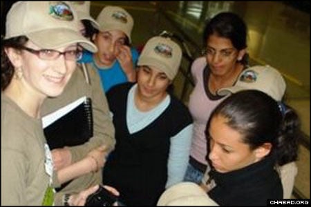 A counselor, left, with Camp Gan Israel of Running Springs, Calif., meets her new campers from Sderot, Israel, at Los Angeles International Airport.