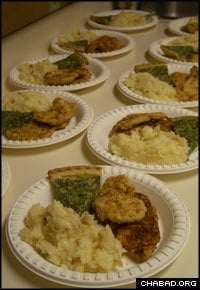 Plates of kosher entrees prepared by Grand Canyon Kosher Catering await packaging for a visiting group from Israel.