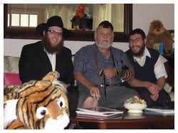 Peter put on Tefillin as we and his stuffed animals looked on.