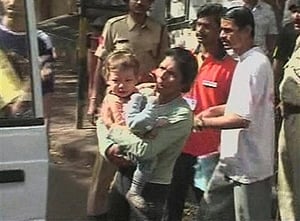 Sandra Samuel escaping from the Mumbai Chabad House with 2-year-old Moshe'le Holtzberg in her arms