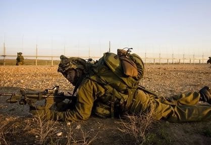An AP photo of Avraham Meir Ostfeld on actual duty