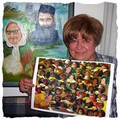 Batya with a photo of her &quot;children,&quot; and a painting of her parents in the background.