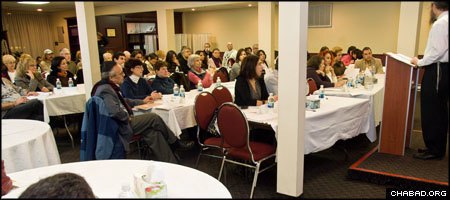 A Rohr Jewish Learning Institute class fills a hall at Chabad of Queen Mary in Montreal. (Photo: Menachem Serraf)