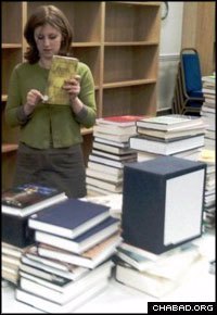 Chabad of Oxford co-director Freida Brackman sorts through the collections of the Samson Judaica Library.