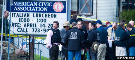 Police gather outside the American Civic Association in downtown Binghamton, N.Y. (Photo: Steven Gorgos)
