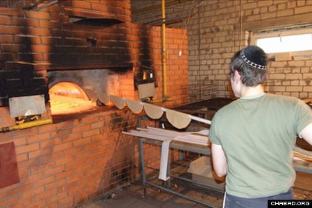 A baker puts hand-rolled matzahs in the oven at a bakery in Dnepropetrovsk, Ukraine.