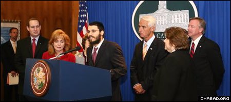 Chabad-Lubavitch Rabbi Schneur Oirechman speaks at a signing ceremony in the office of Florida Gov. Charlie Crist.
