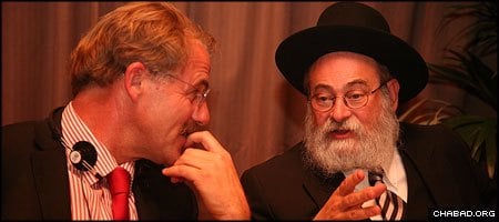 Chabad-Lubavitch Rabbi Binyamin Jacobs, right, chief rabbi of Holland, discusses Jewish prisoner issues with a fellow participant at this week’s European Chaplains Conference.