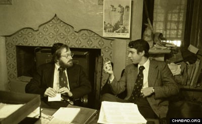 Two doctors discuss the Rebbe's health situation in a makeshift doctor's office in Lubavitch World Headquarters (Photo: Levi Freidin courtesy of JEM)
