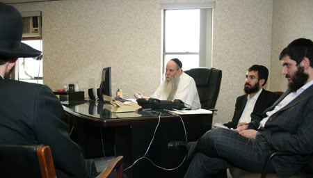 Rabbi Moshe Kotlarsky, aided by his son, Rabbi Mendy, and Rabbi Schneor Nejar prepares rovers for their summer’s work.