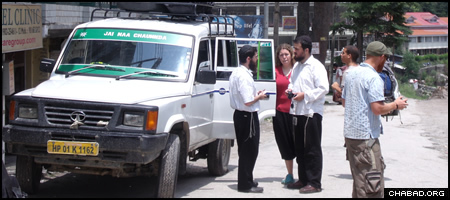 Rabbis Yehuda Kirsch, left, and Levi Pekar, prepare to take another group of volunteers from Manali, India, to search for missing American-Israeli backpacker Amichai Shtainmetz.