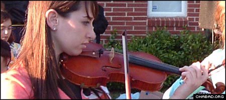 Toby Eagle, a violinist and camp counselor, passed away in a car accident two years ago. Proceeds from a concert in her memory will support music education at the Lev Lalev orphanage.