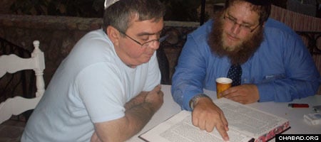 Rabbi Chaim Azimov and a Jewish resident of North Cyprus tackle an ancient text.