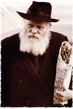 The Rebbe brings willows to the synagogue for the Hoshannah Rabbah prayer service