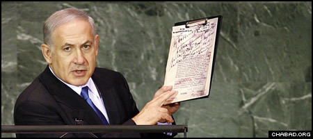 Israeli Prime Minister Benjamin Netanyahu holds up a copy of Nazi plans for the Holocaust during his Sept. 24 address to the United Nations General Assembly. (Photo: UN/Marco Castro)
