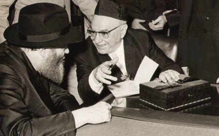  President Zalman Shazar presents the Rebbe with never before published manuscripts of Chabad philosophy.