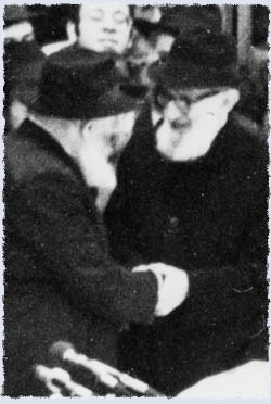 Rabbi Joseph B. Soloveitchik is greeted by the Rebbe at a chassidic gathering in Lubavitch World Headquarters.