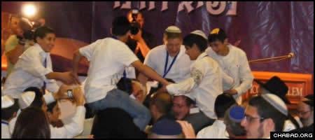 Israeli orphans celebrate after their mass Bar Mitzvah ceremony at Jerusalem’s Western Wall.