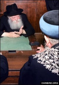 The Rebbe, Rabbi Menachem M. Schneerson, of righteous memory, and Eliyahu meet in 1989, one of three audiences they had at Lubavitch World Headquarters in New York.