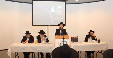 Rabbi Shmuel Kaminetzki, Chief Rabbi of Dnepropetrovsk, Ukraine, addresses the young men, as Rabbis Moshe and Mendel Kotlarsky and Yosef C. Kantor look on.