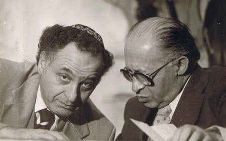 Prime Minister Begin consults with his aide Yehuda Avner. (Photo courtesy of Yehuda Avner)