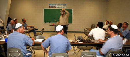 A volunteer with the Chabad-Lubavitch run Aleph Institute leads a Torah class for Jewish prisoners at the Dade Correctional Institution in Florida City, Fla.