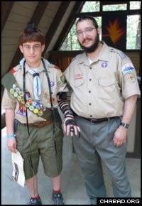 Rabbi Mendy Wineberg poses with one of his Jewish scouts. The troop is just one of many projects run by the Chabad House Center of Kansas City, the regional Chabad-Lubavitch headquarters of Kansas and Missouri founded by Wineberg’s parents, Rabbi Sholom and Blumah Wineberg, 40 years ago.
