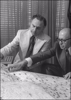 Prime Minister Begin and Mr. Yehuda Avner review a map of Israel.