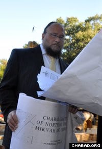 Rabbi Yoseph Kahanov reviews plans for Chabad-Lubavitch of Northeast Florida’s ritual bath.