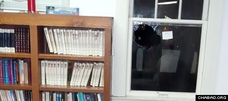 A rock hurled through the center window of the Chabad House Jewish Student Center at Indiana University Bloomington left shards of shattered glass spread like tiny icicles across the entire sanctuary.