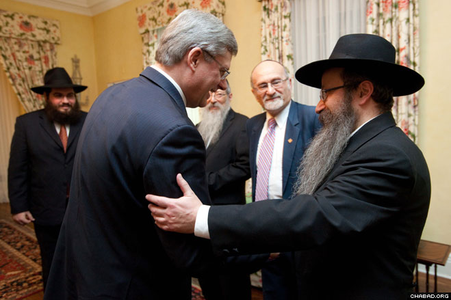 At the first-ever Chanukah celebration at Canada’s prime ministerial residence, Prime Minister Stephen Harper recalled the celebration he attended in his hometown of Calgary with Rabbi Menachem Matusof, director of Chabad-Lubavitch of Alberta. As the two talked, Rabbis Chaim Mendelsohn, director of Chabad of Centrepointe in Ottawa; Avraham Altein, director of the Lubavitch Centre of Winnipeg; and Reuven Bulka, a former co-president of the Canadian Jewish Congress, looked on.