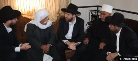 A delegation from the Chabad Terror Victims Project meets with the family of Jalal Bissan, who perished in Israel’s Carmel Fire.
