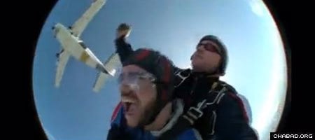 University of Washington student Michael Eisenberg skydives after a plane-based prayer service.