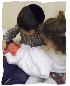 Asher Yisrael with his siblings
