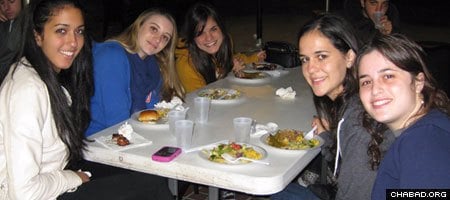 University of Florida undergrads enjoy a kosher meal at the Tabacinic Lubavitch-Chabad Jewish Student & Community Center in Gainesville.