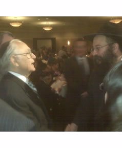 Shimon Vishnepolsky (left) with his Chabad rabbi